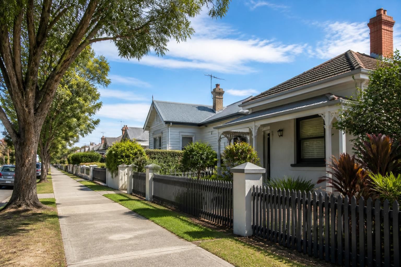 Bright Sunshine streetscape with neat residential houses.
